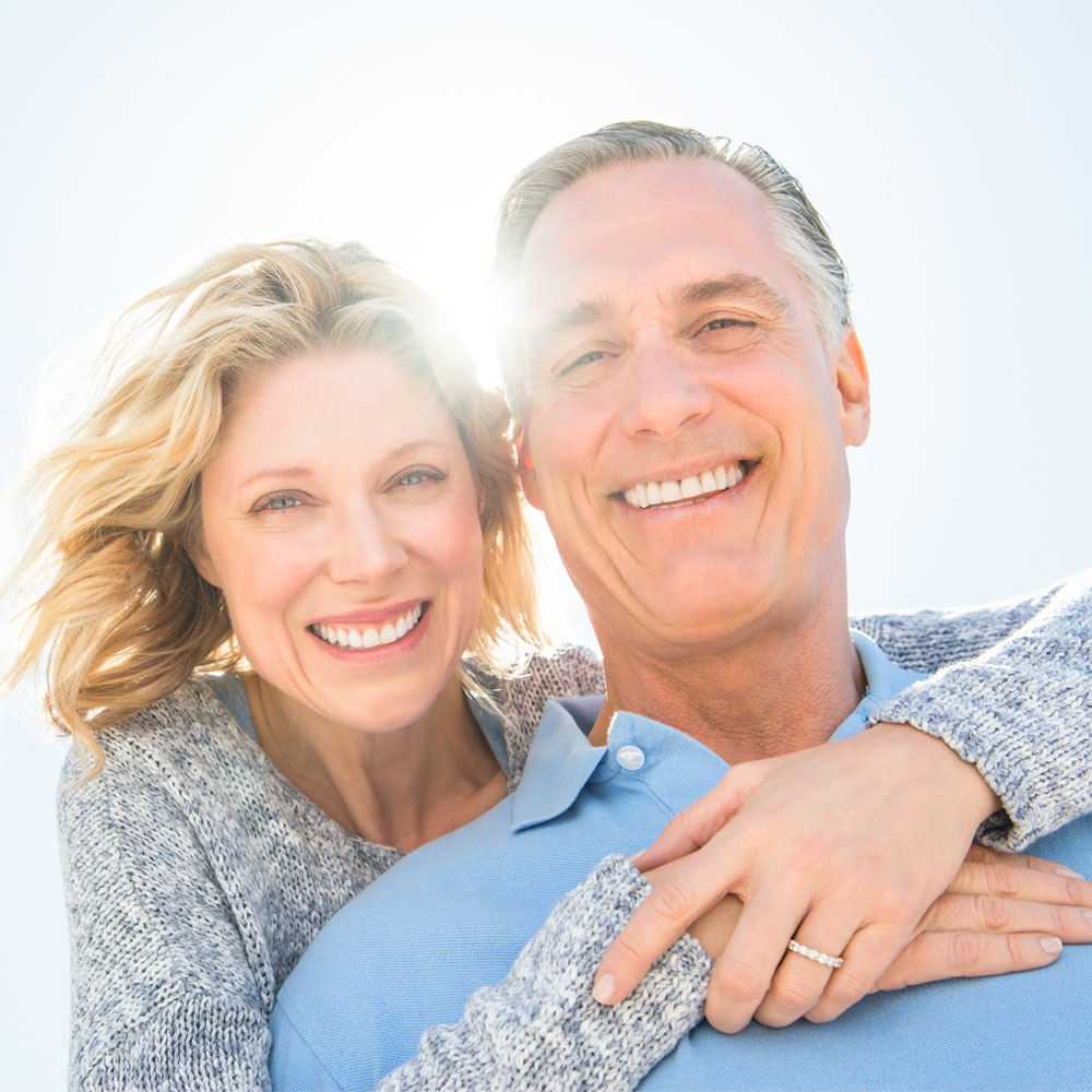 Elevation Med Spa Lone Tree Colorado close up of older couple smiling enjoying a sunny day outside