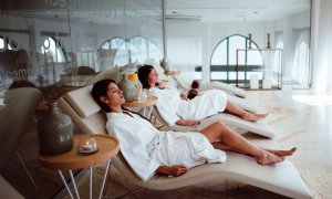 Elevation Med Spa Lone Tree Colorado two women relaxing on comfortable chairs at spa