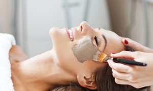 Elevation Med Spa Lone Tree Colorado woman getting facial with brown mask