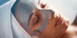 Elevation Med Spa Lone Tree Colorado woman relaxing during gray facial mask