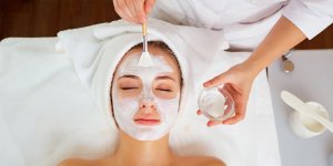 Elevation Med Spa Lone Tree Colorado woman getting facial with white mask