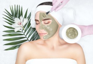Elevation Med Spa Lone Tree Colorado woman receiving green clay mask spa treatment