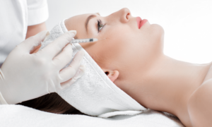 Elevation Med Spa Lone Tree Colorado - young woman receiving Botox injections from medical professional